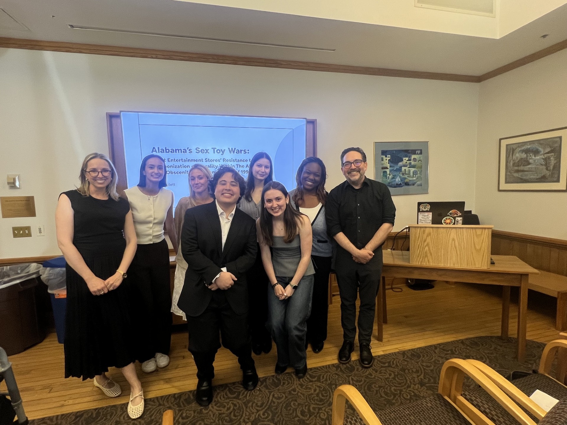 Professor and Seniors at Senior Symposium